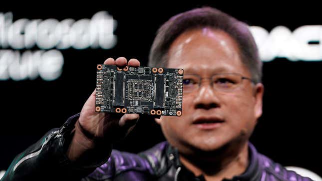 Jensen Huang, CEO of Nvidia, shows the NVIDIA Volta GPU computing platform at his keynote address at CES in Las Vegas, Nevada, U.S. January 7, 2018