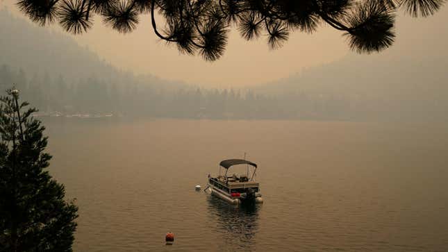 Smoke from the Caldor Fire, shrouds Fallen Leaf Lake near South Lake Tahoe, California.