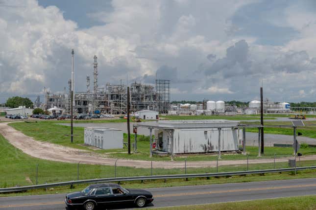 The Denka, formerly DuPont, factory in Reserve, Louisiana, on August 12, 2021. - Silos, smokestacks and brown pools of water line the banks of the Mississippi River in Louisiana, where scores of refineries and petrochemical plants have metastasized over a few decades.