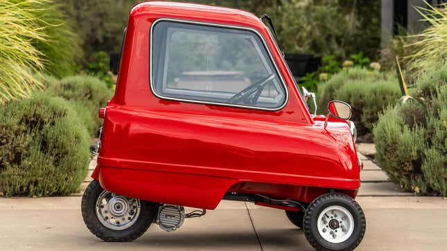 A side view of the bright red Peel P50