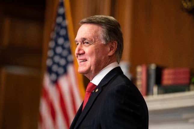 Senator David Perdue, R-GA, poses for a photo with Judge Amy Coney Barrett, President Donald Trumps nominee for Supreme Court, before a meeting at the US Capitol on September 30, 2020, in Washington, DC. 