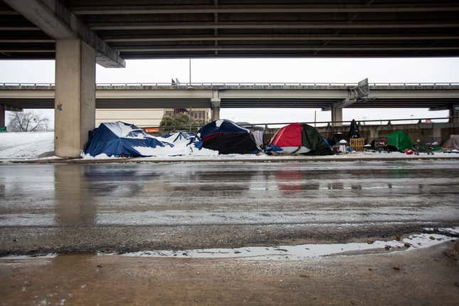 Homeless camps sit along the I-35 frontage road in Austin, Texas on February 17, 2021. 