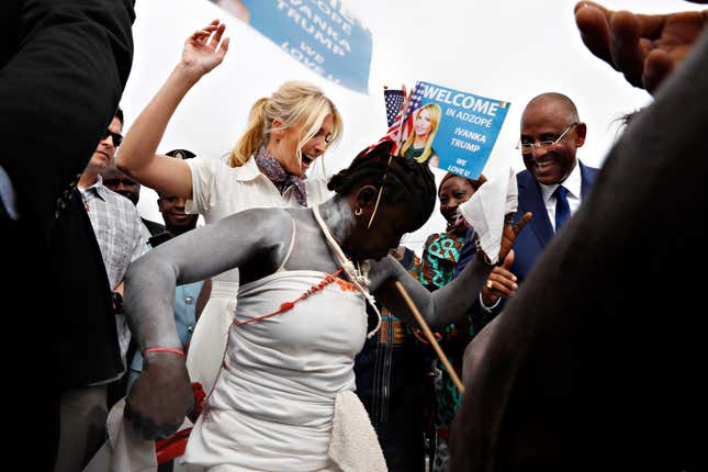 White House senior adviser Ivanka Trump dances with traditional dancers as she is welcomed by local people on arrival to Adzope, Ivory Coast, Wednesday April 17, 2019, where she will tour Cayat, a cocoa and coffee cooperative.