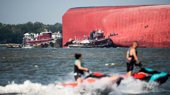 Emergency responders work to rescue crew members from a capsized cargo ship on September 9, 2019 in St Simons Island, Georgia. A 656-foot vehicle carrier, the M/V Golden Ray departed the Brunswick port on Sunday and suffered a fire on board, capsizing in St. Simons Sound