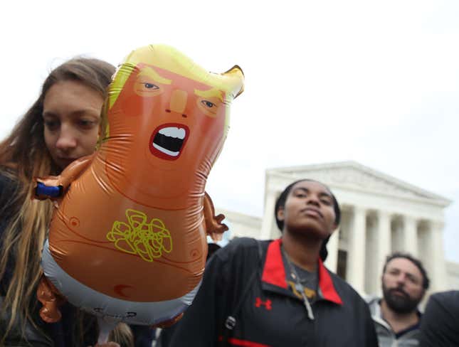 Protesters rally in front of the U.S. Supreme Court as arguments are heard in a set of cases concerning the rights of LGBTQ people in the workforce, in Washington, D.C. 