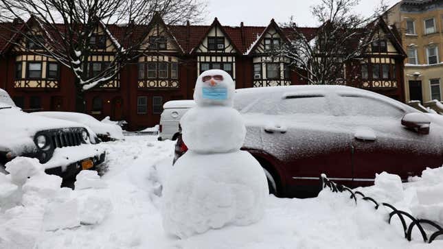 A snowman with a mask is seen in the Flatbush neighborhood of Brooklyn on February 02, 2021, in New York City. A nor’easter dumped up to 17 inches of snow in certain areas of NYC and blanketed parts of the Midwest and Mid-Atlantic with snow earlier this week.