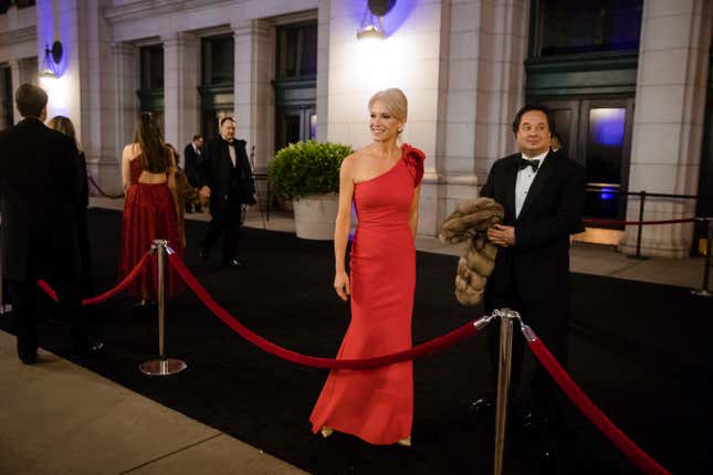 Kellyanne Conway, center, accompanied by her husband, George, speaks with members of the media as they arrive for a dinner at Union Station in Washington, the day before Trump’s inauguration.