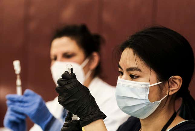 A pharmacist volunteer prepares doses of the Johnson and Johnson COVID-19 vaccine during a pop-up clinic at Western International High School on April 12, 2021 in Detroit, Michigan. The state of Michigan has seen an explosion of COVID-19 cases despite a massive effort to roll out vaccines. Pop-up clinics in various communities are one of the ways the state government is trying to get the surge under control. 