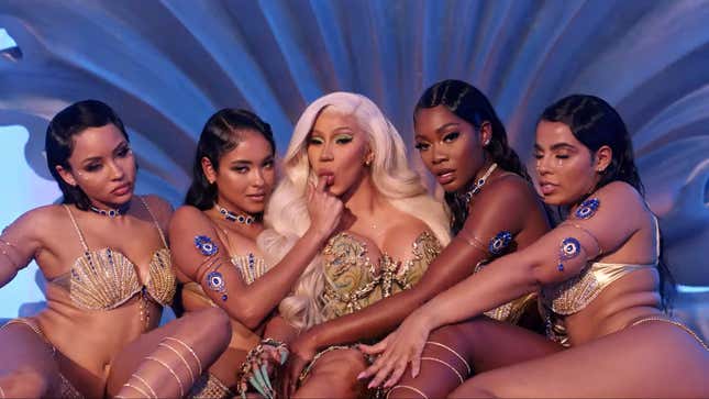 Image for article titled Cardi B Using a White Man As a Table, and Other Important Moments from the 'Up' Video