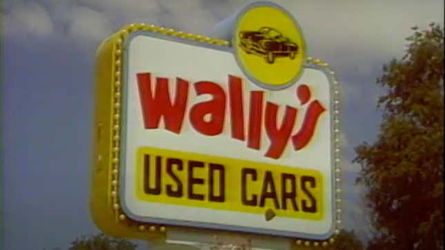 A photo of the Wally's Used Car Lot sign at a dealer in America.  