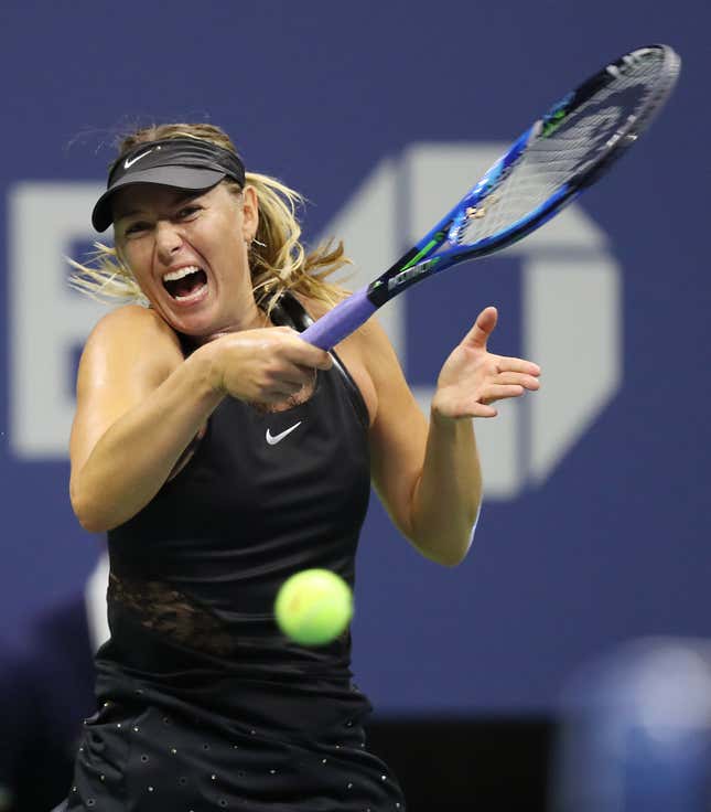 epa06169480 Maria Sharapova of Russia hits a return to Simona Halep of Romania on the first day of the US Open Tennis Championships at the USTA National Tennis Center in Flushing Meadows, New York, USA, 28 August 2017. The US Open runs through September 10. EPA-EFE/DANIEL MURPHY