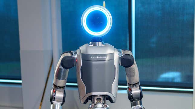 a robot with a glowing blue circle as a "head"