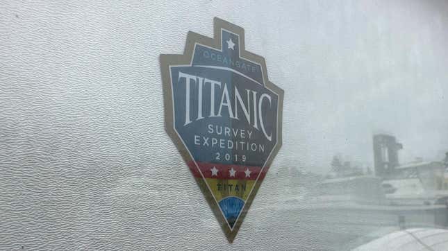 The logo for an OceanGate Expeditions 2019 Titanic expedition is seen on a marine industrial warehouse office door in Everett, Wash., Tuesday, June 20, 2023