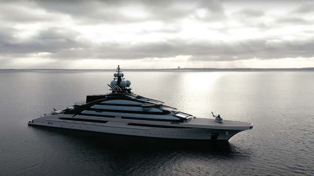 the megayacht Nord sailing near a shoreline under a cloudy sky