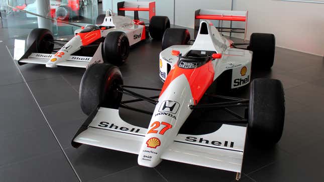 A photo of two McLaren Formula 1 cars in the red and white livery. 