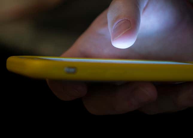 FILE - A man uses a cell phone in New Orleans on Aug. 11, 2019. A recent uptick in scams targeting older adults has seniors wondering who’s really calling them. As the most common type of reported Social Security scam, imposters fool beneficiaries into thinking they are providing information to the agency. (AP Photo/Jenny Kane, File)