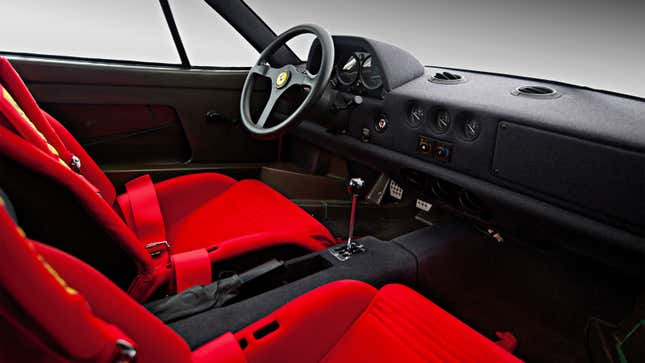 A photo of the interior of a Ferrari F40 supercar. 