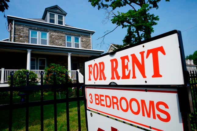 FILE - A sign indicating the availability of a home to rent stands outside a building in Philadelphia, Wednesday, June 22, 2022. Remote working has led to so-called “bleisure” travel, where employees mix work and leisure on the same trip. This trend appears to be affecting the lodging industry, with demand for short-term rentals such as Airbnb outpacing that for hotels. With more and more travelers working on vacation — and extending their trips to do so — they’re looking for the amenities short-term rentals provide. (AP Photo/Matt Rourke, File)