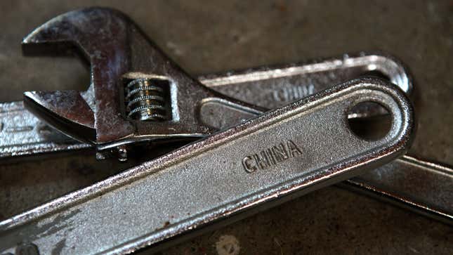 A close up photo of three adjustable wrenches. 