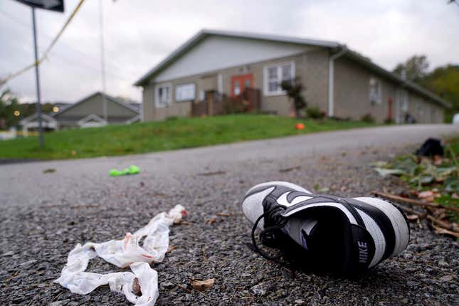 Debris, mixed with personal items including shoes, are scattered after a fatal shooting near the Chevy Chase Community Center in White Township, Indiana County, Pa., Sunday, Oct. 8, 2023. State police in Indiana County said troopers, local officers and emergency services responded at 12:35 a.m. Sunday to the shooting at the center in White Township, about 50 miles (80 kilometers) northeast of Pittsburgh. (Sean Stipp/TribLIVE.com via AP)