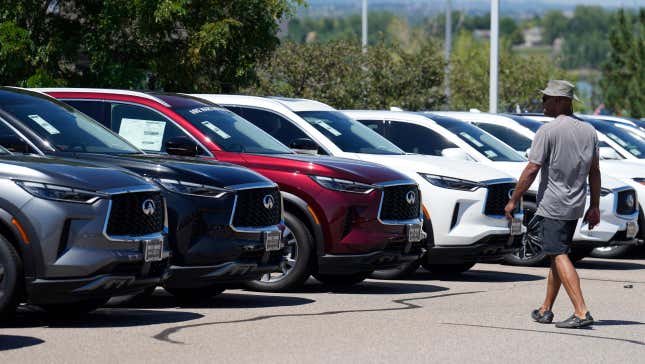 FILE - A prospective buyer surveys a row of unsold 2023 QX60 luxury sports-utility vehicles at an Infiniti dealership Sunday, Aug 27, 2023, in Highlands Ranch, Colo. (AP Photo/David Zalubowski, File)