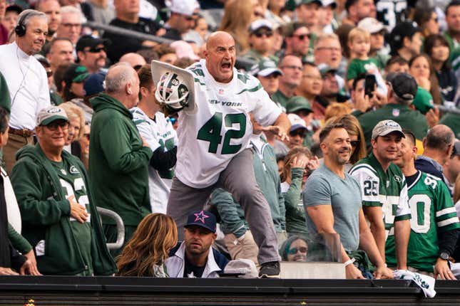 Fireman Ed leads the crowd in a cheer during the first half of the game between the Dallas Cowboys and the New York Jets