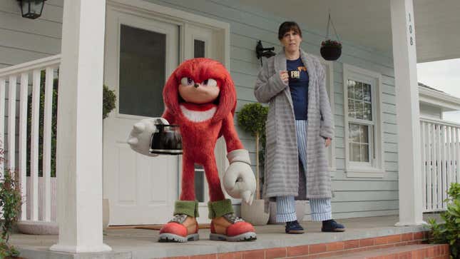Knuckles and Wanda stand on a front porch.