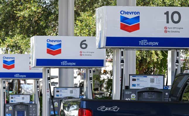 Gas pumps are seen at a Chevron gas station in Orlando. Chevron Corp announced that it has agreed to buy Hess Corporation for $53 billion in stock. 