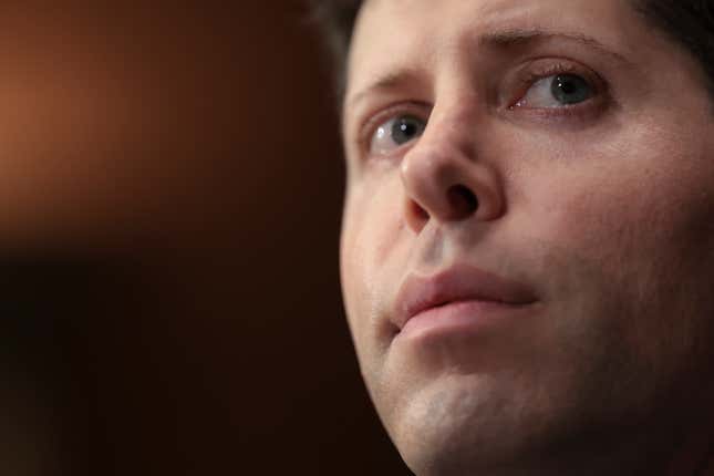 Close-up of Sam Altman's face against a black backdrop