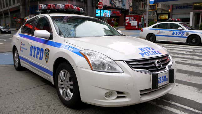 A New York Police Department Nissan Altima parking in Times Square