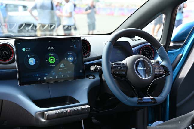 The interior of a BYD Dolphin all electric EV is displayed during the British Motor Show at Farnborough International Exhibition Centre on August 17, 2023 in Farnborough, England. 