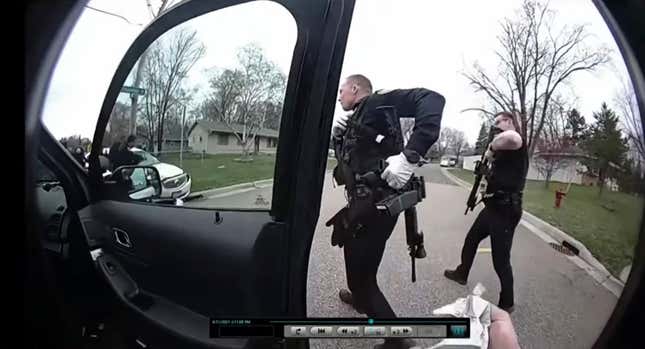 In this image taken from Brooklyn Center Police Officer Jeffrey Sommers’ police body cam video that was played during the trial of former Brooklyn Center police Officer Kim Potter on Thursday, Dec. 9, 2021, in Minneapolis, police approach the car that Daunte Wright was driving after being shot during a traffic stop. Potter, who is white, is charged with first- and second-degree manslaughter in the shooting of Wright, a Black motorist, in the suburb of Brooklyn Center. Potter has said she meant to use her Taser – but grabbed her handgun instead – after Wright tried to drive away as officers were trying to arrest him.