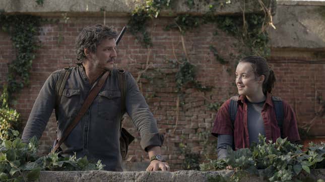 Pedro Pascal as Joel and Bella Ramsey as Ellie looking at each other in a scene from The Last of Us HBO series