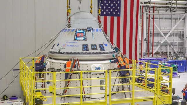 The team at NASA’s Kennedy Space Center working to mate Starliner’s crew module with its service module in January 2023. 