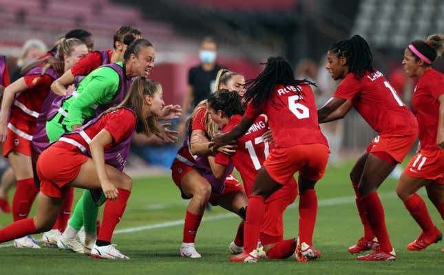 Players of Team Canada celebrate their side's first goal scored by Jessie Fleming of Team Canada during the Women's Football Semifinal match between USA and Canada at Kashima Stadium on August 02, 2021 in Kashima, Ibaraki, Japan. 
