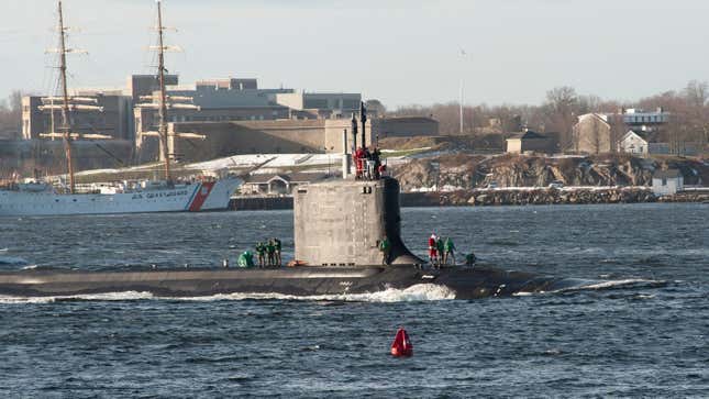 Santa stands on the bow of the USS Vermont.