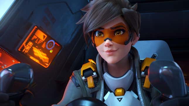 Tracer sits in a pilot seat.