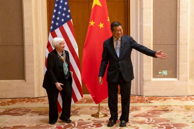 Chinese Vice Premier He Lifeng (R) gestures to Treasury Secretary Janet Yellen during a meeting at the Diaoyutai State Guesthouse