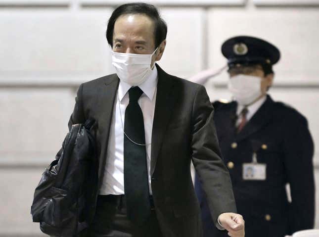 Kazuo Ueda, the governor of the Bank of Japan arrives at the bank headquarters in Tokyo, Japan Tuesday, March 19, 2024. Japan’s central bank raised its benchmark interest rate Tuesday for the first time in 17 years, ending a longstanding policy of negative rates meant to boost the economy. (Japan Pool/Kyodo News via AP)