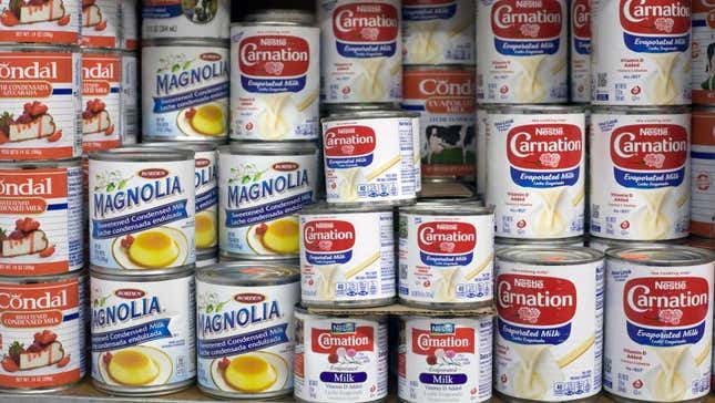 Cans of Carnation evaporated milk at grocery store