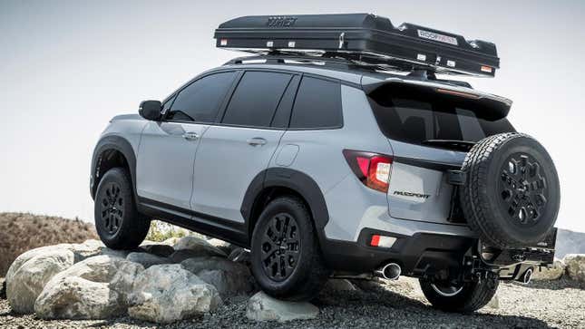 A gray passport parked on some rocks