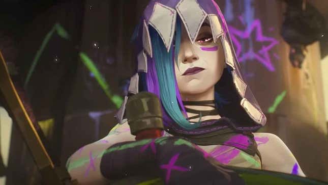 Jinx stands wearing a hood and covered in purple paint