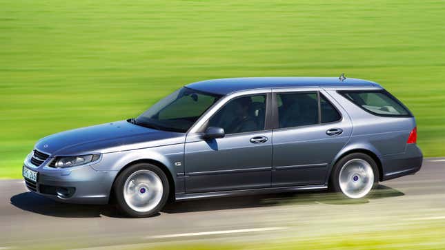 A photo of a Saab 9-5 Aero wagon driving on a highway. 