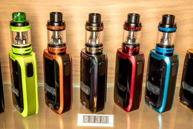 This shows a row of vapes in an Auckland store, on Feb. 11, 2018. The New Zealand Government said Wednesday, March 20, 2024, that it will ban disposable e-cigarettes, or vapes, and raise financial penalties for those who sell such products to minors. (Michael Craig/New Zealand Herald via AP)