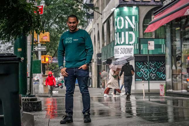 Coss Marte, owner of CONBUD marijuana dispensary, poses outside his store, which was previously the site of a bank, Thursday, Sept. 28, 2023, in New York. New York is set to dramatically expand its legal weed market and issue more than 1,000 new licenses starting early next year in a move that worries farmers and retailers, who fear they will be squeezed out by deeper-pocketed companies who will be able to both grow and sell. (AP Photo/Bebeto Matthews)