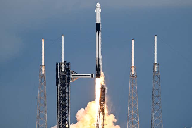 Rocket launch against a blue sky