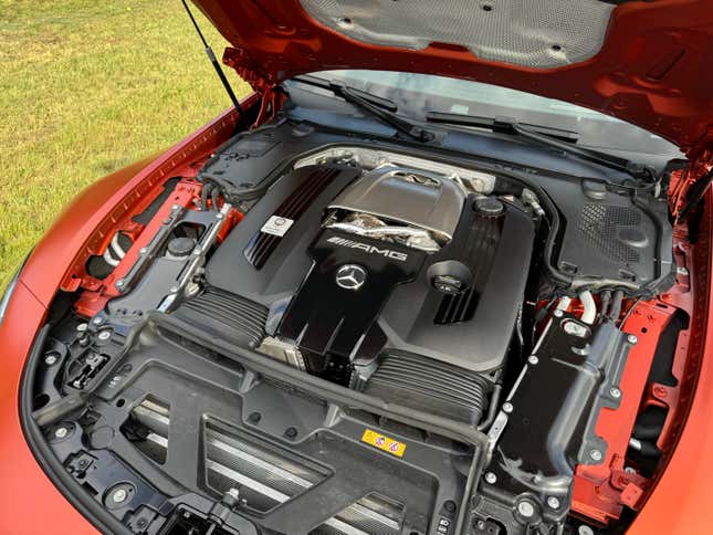 Engine bay of a matte orange 2025 Mercedes-AMG GT63 S E Performance