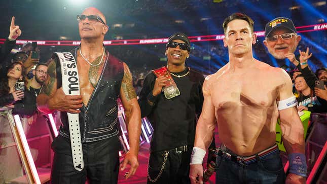 The Rock (left), Travis Scott (middle), and John Cena (right) standing like villains