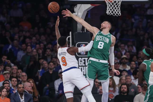 Oct 25, 2023; New York, New York, USA; Boston Celtics center Kristaps Porzingis (8) blocks a shot taken by New York Knicks guard RJ Barrett (9) in the first quarter at Madison Square Garden.