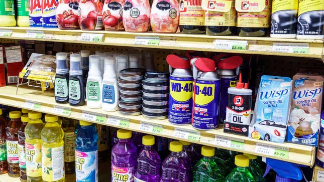 A hardware store shelf featuring WD-40 among various cleaners and other household items.